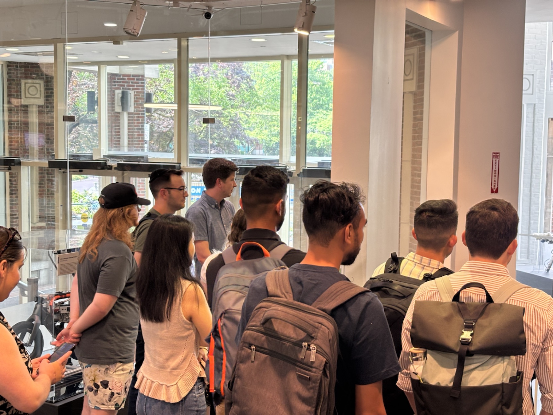 Visitors listening to a robotics demonstration