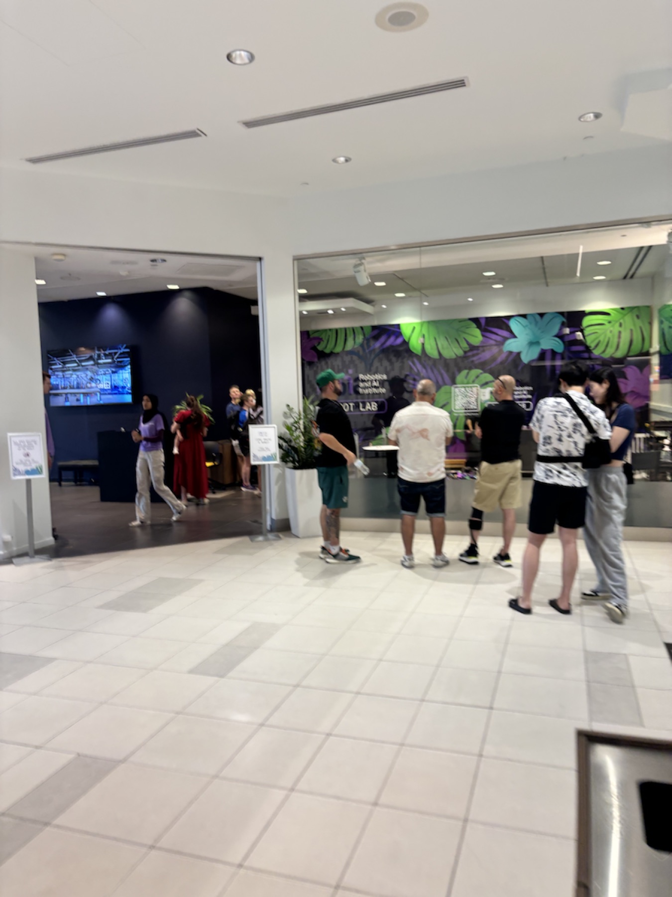 A wide view of the public Robot Lab entrance and visitors